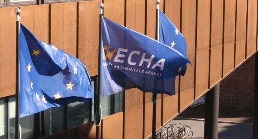 European Union flags and ECHA banner displayed outdoors at Plastics Europe conference.