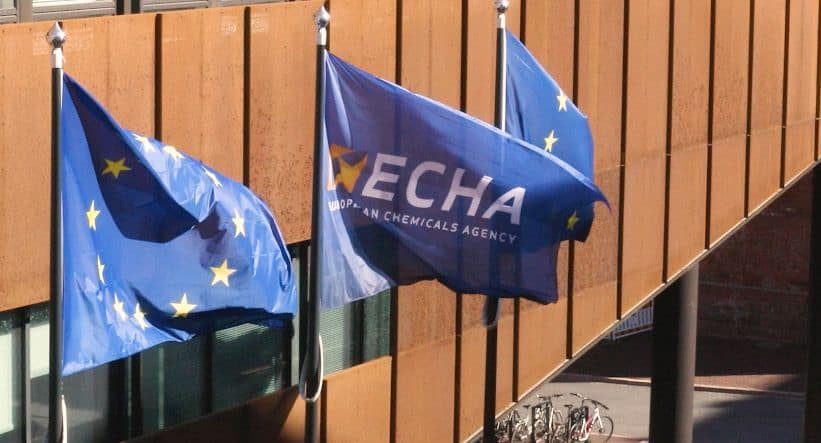 European Union flags and ECHA banner at a plastics industry event.